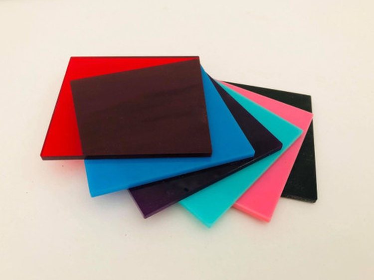 A fan of red, blue, black, teal and pink acrylic sheets