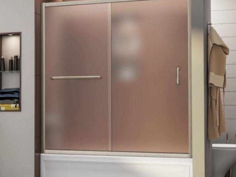 A sliding shower door with frosted acrylic panels